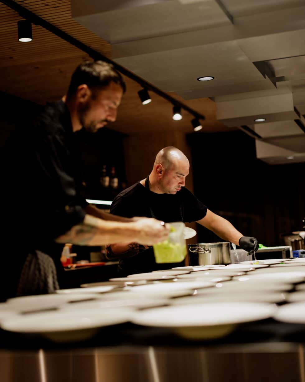 a man in black shirt preparing food